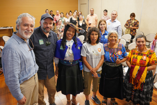 Juan Camilo Cárdenas (left) with representatives from the indigenous communities from New Zealand and Colombia at the event "Biodiversity for the Common Good". Photo by: Arturo López Tunubalá, UniAndes.