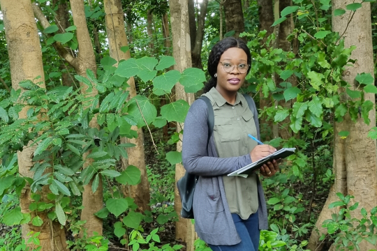 Chizoba during a field trip in Malawi forest