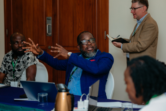 three men discussing