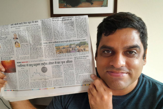 Man showing newspaper