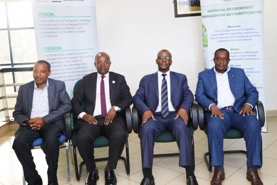 Directors of the East African EfD Centres posing for a group photo with NEMA Executive Director Akankwansa Birerega (3rd) in Kampala.Photo by EfD-Mak Centre