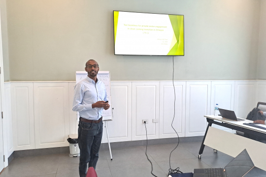 Mr. Abrham presenting the proposed tax exemption policy instrument