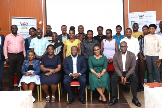 Participants in a group photo after the opening session