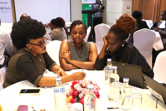 Participants in group discussing