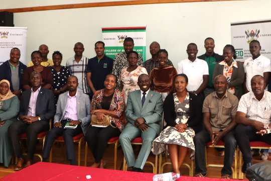  Participants pose for a group photo after the opening session at Night Rose Hotel