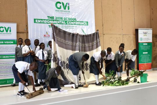 Children on stage with trees