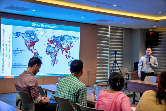 Presentation on climate change, flood risk, communication, and women’s participation