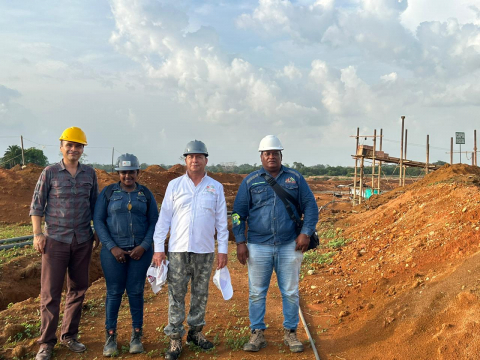 Men in front of a mining field