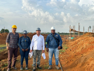 People in front of a mining area