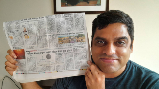 Man showing newspaper