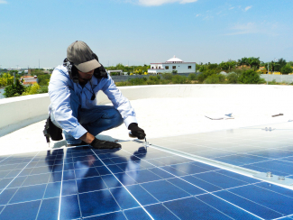 Man installing solar panels