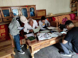 Farmers in Gansu Province showing interviewers their Forest Rights Certificates