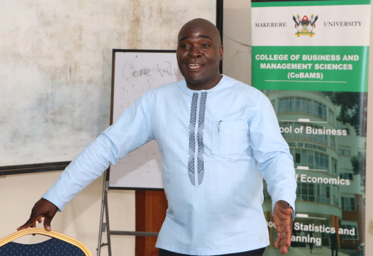 Dr. John Sseruyange presenting