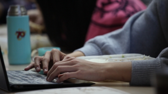 Hands working in a computer