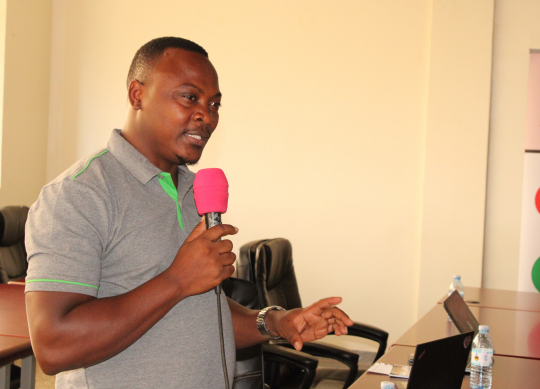 Ag. Director EfD-Mak centre Fred Kasalirwe presenting.jpg