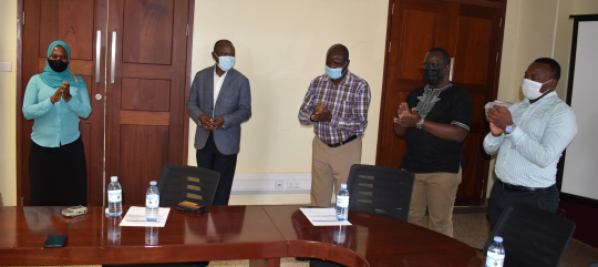 Assoc. Prof. Eria Hisali (2nd) launching the projects flanked by some of the grantees