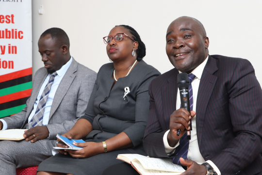 Dr. John Sseruyange( R) giving his persepective