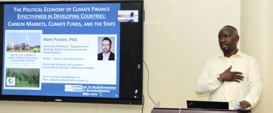 Patrick Byakagaba (R) introducing Prof. Mark Purdon at the opening session: Photo by Jane Anyango