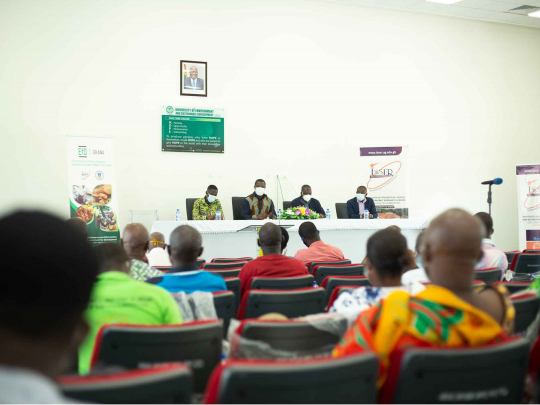 Key speakers and participants seated at the workshop