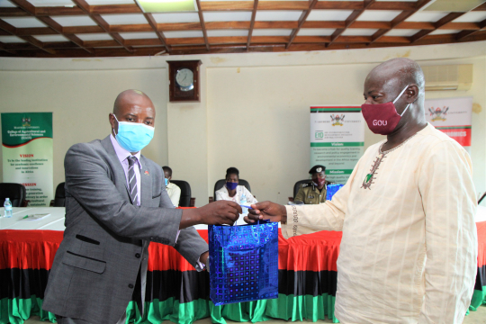 EfD-Mak Centere Director Assoc. Prof. Edward Bbaale presenting a gift to Mukono district Natural Resources officer Mr. William Mujuni.jpg