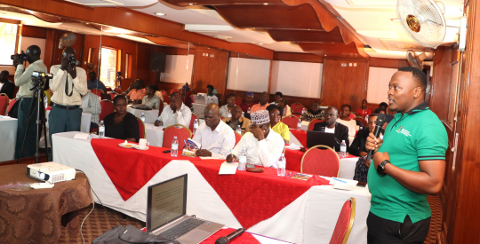 Fred Kasalirwe presenting the research findings at Tick Hotel in Kewempe