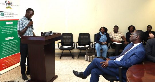 Mchapondwa (R) listening to presentations from the group activities
