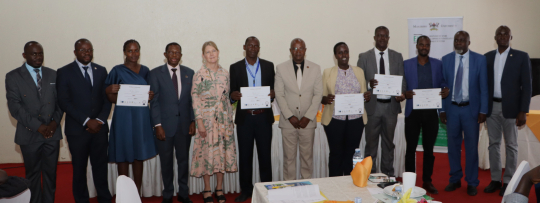 Graduands posing for a group photo with the Ambassodor, Prof. Buyinza Mukadasi and Prof. Edward Bbaale.