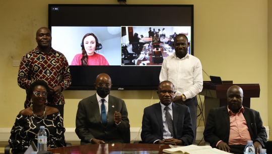 IGE Fellows cohort 2021 pose for a group photo with Prof. Edward Bbaale and Dr. Eria Hisali (2nd and 3rd) after the opening