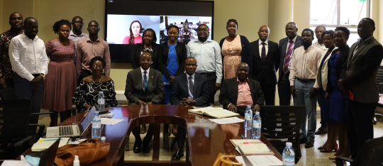 IGE Fellows posing for a group photo with the Director EfD Mak center and the Chief Guest Dr. Eria Hisali after the opening ceremony