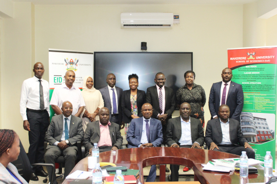 The IGE Fellows posing for a group photo with Eria Hisali, Edward Bbaale, Mike Irahim Okumu and centre staff 