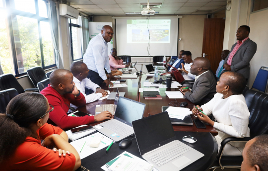EfD members discussing at NEMA head office in Kampala Uganda