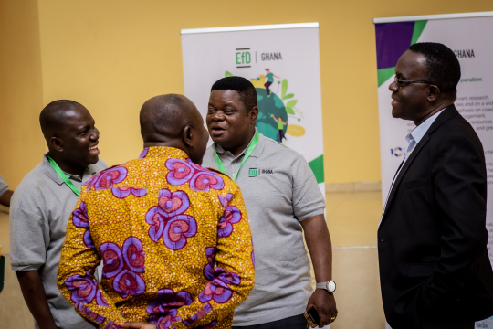 Peter Quartey in a hearty conversation with Deputy Minister, Moses Anim, Wisdom Akpalu and Daniel Twerefou of EfD Ghana.