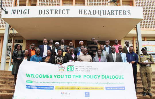 Participants posing for a group photo after the policy dialogue.