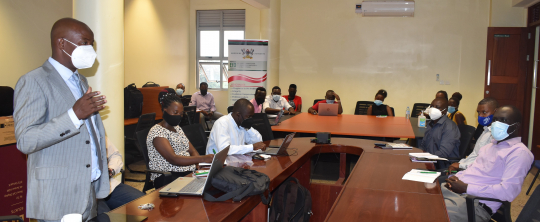 Prof. Bbaale speaking to participants during the seminar at Makerere University.jpg
