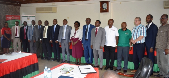 Key guests and panelists posing for a group photo after the opening ceremony