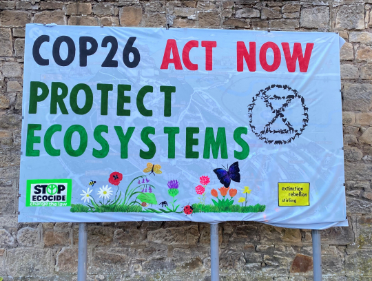Protest sign outside the COP26 venue