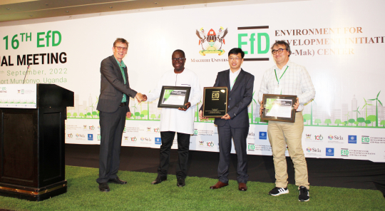The three winners pose with their plaques after the awards in Uganda