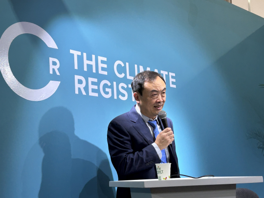 Xu Jintao talks about the role of forest carbon sinks in climate action. Photo: Shi Xiangying