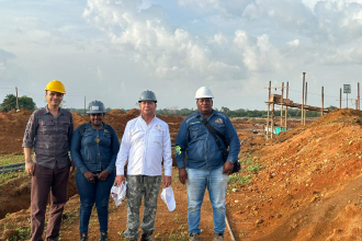 People in front of a mining area