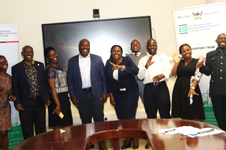 The five IGE fellows in a group photo with the centre core staff after the inauguration ceremony: Photo by Jane Anyango