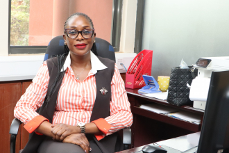 Maureen Anino  speaking from her office 