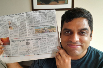 Man showing newspaper