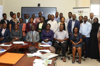 Government officials pose for a group photo with Director Edward Bbaale (1st front row) Prof. Edwin Mchapondwa (3rd front ),Policy Engagement Specialist Peter Babyenda after the opening session at Makerere University. Photo by Jane Anyango