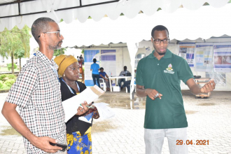 Dr Martin Chegere (right) telling more about the research project 