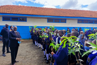 Prof. Richard Mulwa (Center Director), EfD Researchers, representatives from the Ministry of Agriculture, Livestock, Fisheries and Cooperatives, and St. George’s students participate in tree planting. 