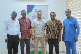 Anthony Amoah (first from right) with fellow researchers at a recent EfD Ghana meeting.