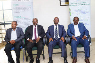 Directors of the East African EfD Centres posing for a group photo with NEMA Executive Director Akankwansa Birerega (3rd) in Kampala.Photo by EfD-Mak Centre