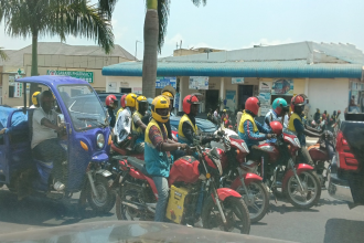 People riding converted electric motorbikes in Rwanda