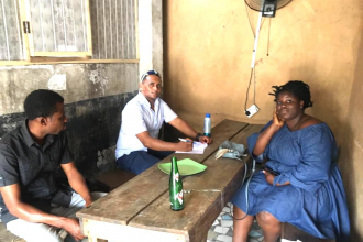 Yonas Alem conducting a pilot interview with one restaurant owner in Lagos. Photo: Meseret Abebe 